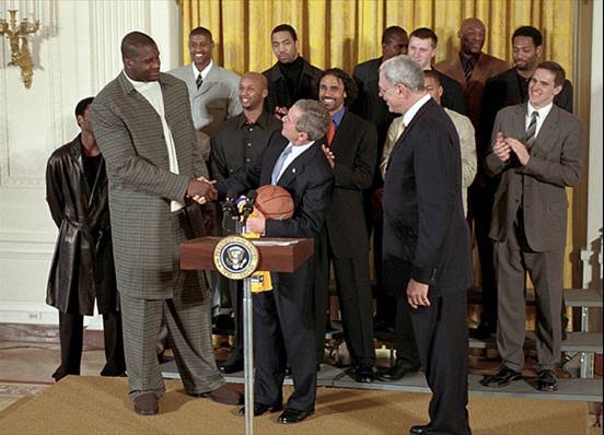 image of Shaquille O'Neill shaking hands with President George W. Bush